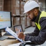 A maintenance manager working on a software